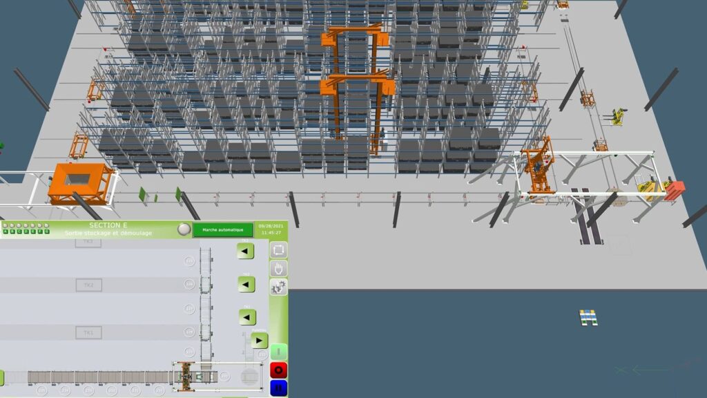 Vue 3D d’une ligne carrousel avec transstockeurs et racks pour moules à béton